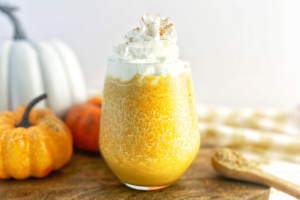 Keto Pumpkin Spice Lactation Smoothie in glass with Whipped Cream
